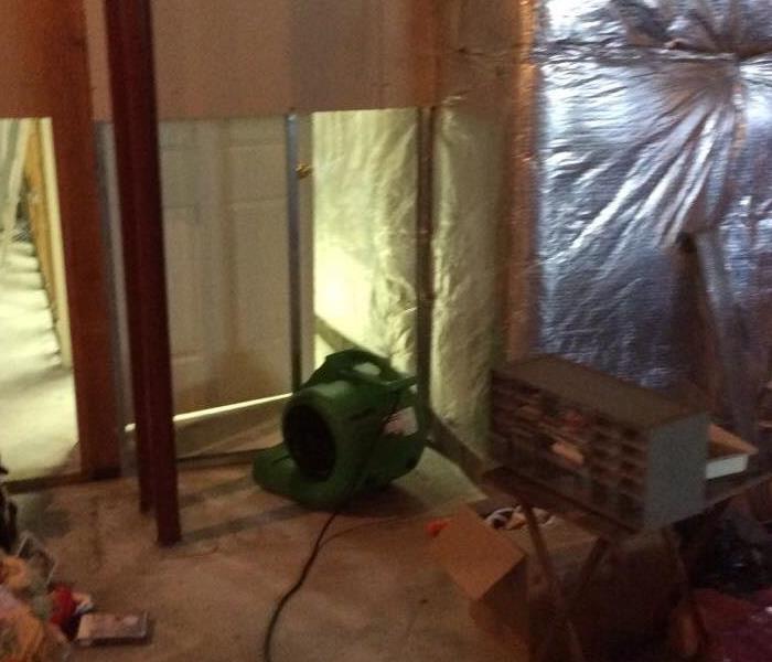 Flood cuts and a green air mover on the floor. 