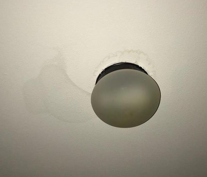 Water stain on a white ceiling.
