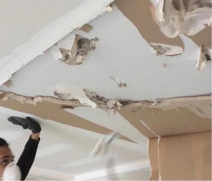 A ceiling of a business affected by storm damage